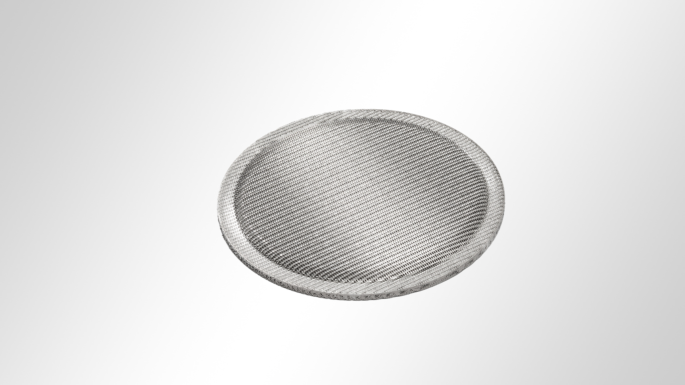 Multi-layered filter disc with edge zone compression