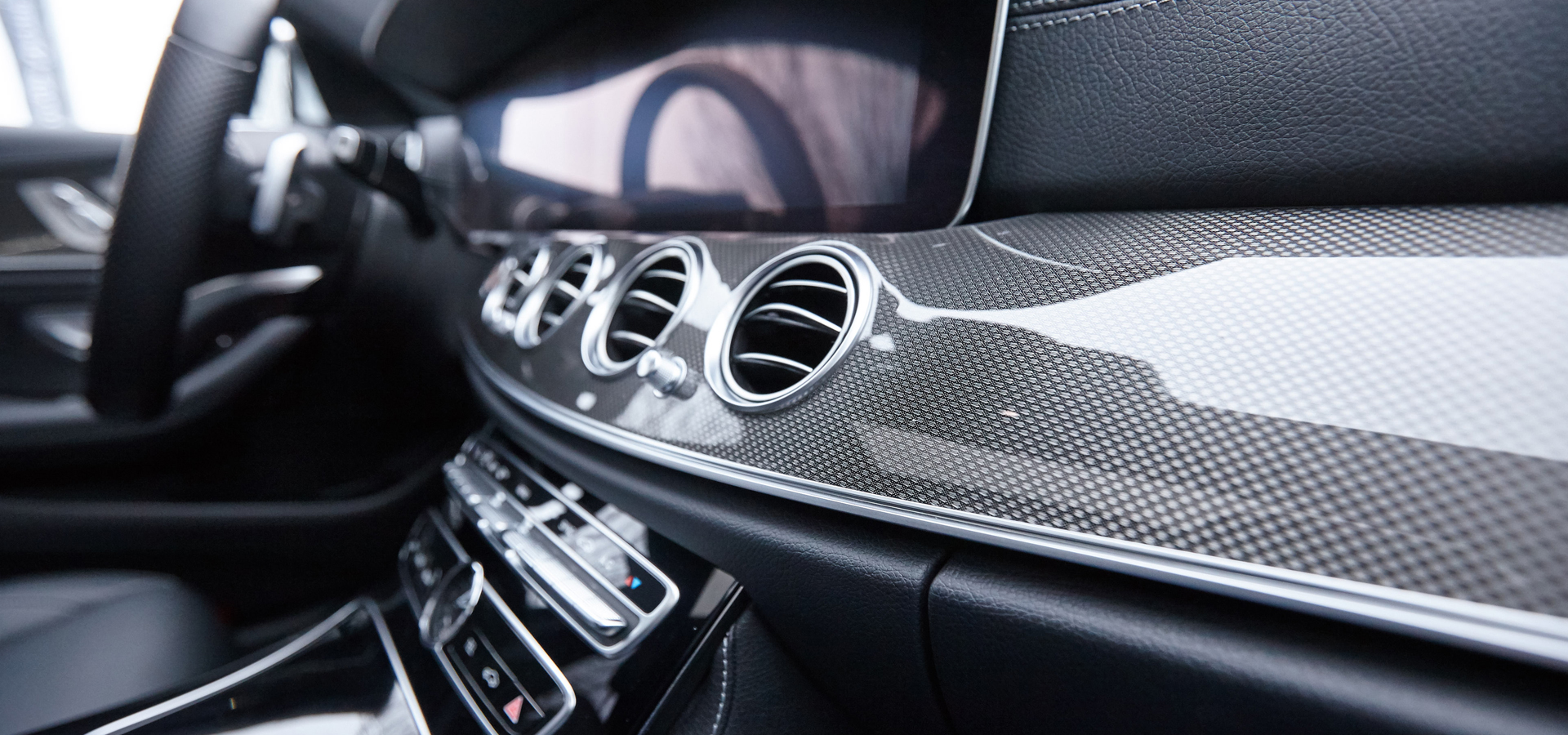 Trim in the vehicle interior with design mesh.