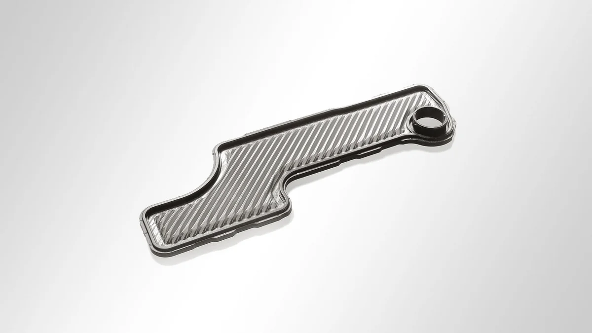 Filtre à huile d'engrenage : plissé, avec surmoulage en plastique et forme spéciale