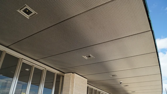 Ceiling covering made out of a dense stainless steel wire mesh with gaps for integration of lighting.