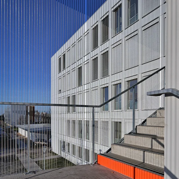 External stair tower cladding with HAVER Architectural Mesh