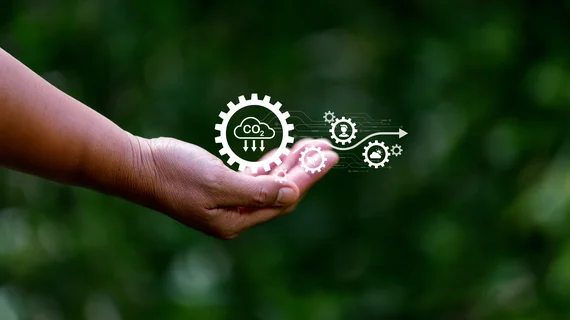 Hand hält Icons zum Thema Umwelt und vor allem CO2-Abscheidung