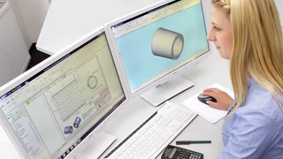 Employee edits a design drawing on the PC