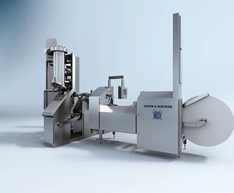 ROTO-PACKER® ADAMS® CARE-LINE EDITION: Geschlossene Edelstahlanlage mit einem Füllstutzen und Rollenmagazin.