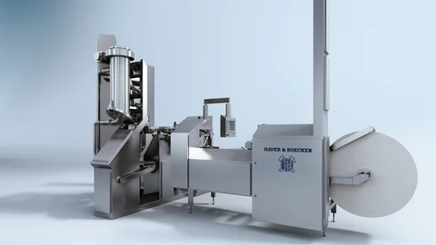 ROTO-PACKER® ADAMS® CARE-LINE EDITION: Geschlossene Edelstahlanlage mit einem Füllstutzen und Rollenmagazin.