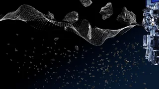 Machine part with wire mesh on the left, through which coarse pieces of rock fall; modern industrial process by Haver & Boecker.