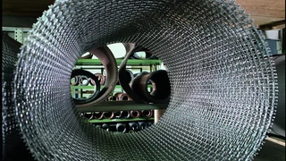 View through a roll of wire cloth in the warehouse