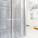 Elevator cladding with stainless steel mesh